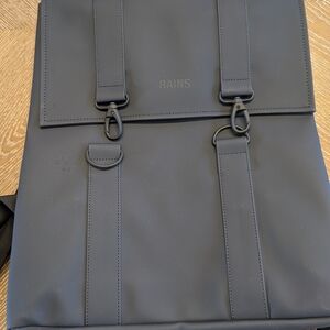 Rains Blue Backpack with Minimalist Design and Waterproof Material